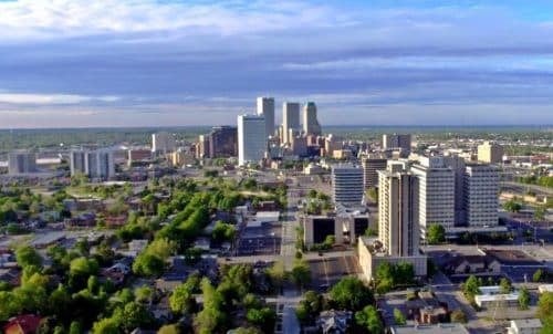 Tulsa Oklahoma skyline at dusk with lit buildings